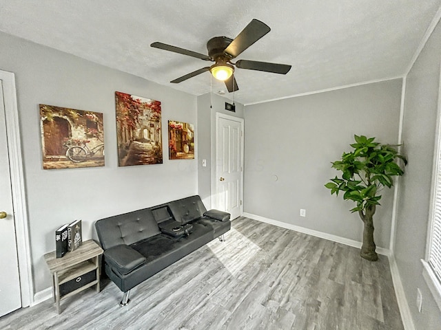 2322 Mecca Rd, Columbus, OH 43224 - sitting room with wood finished floors, ceiling fan, and baseboards