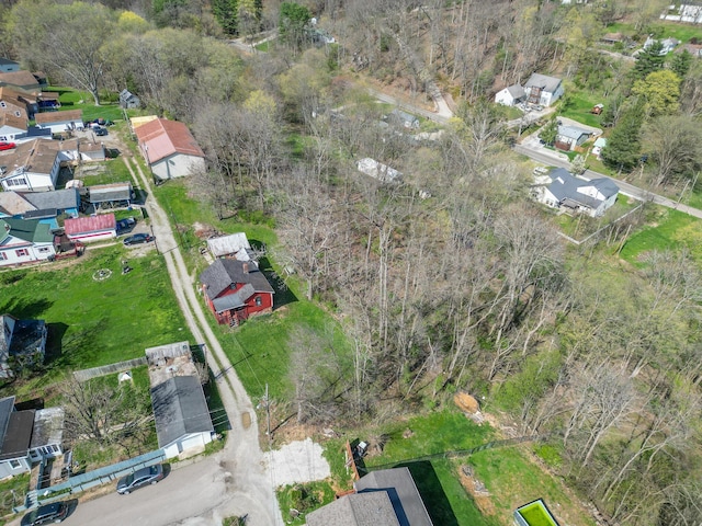 aerial view of property and surrounding area with nearby suburban area