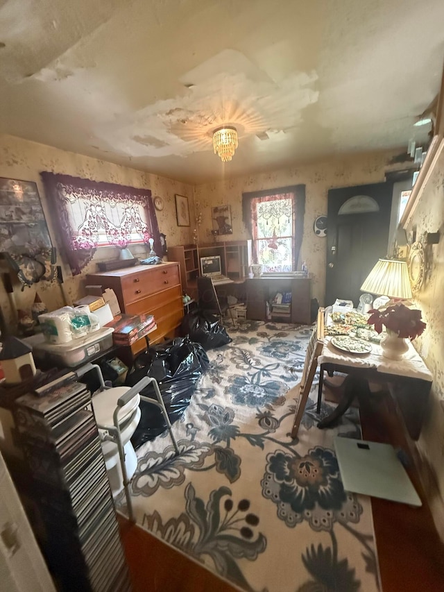 carpeted office with wallpapered walls