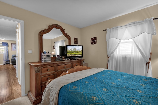 bedroom with wood finished floors