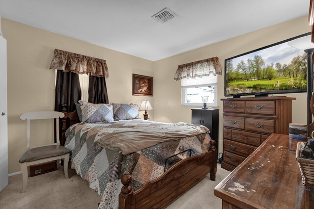 bedroom featuring light carpet