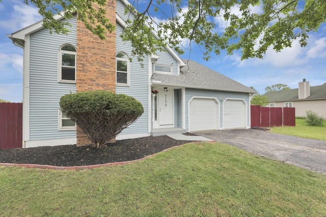 7170 Daugherty Dr, Reynoldsburg, OH 43068 - traditional home with a garage, asphalt driveway, and roof with shingles