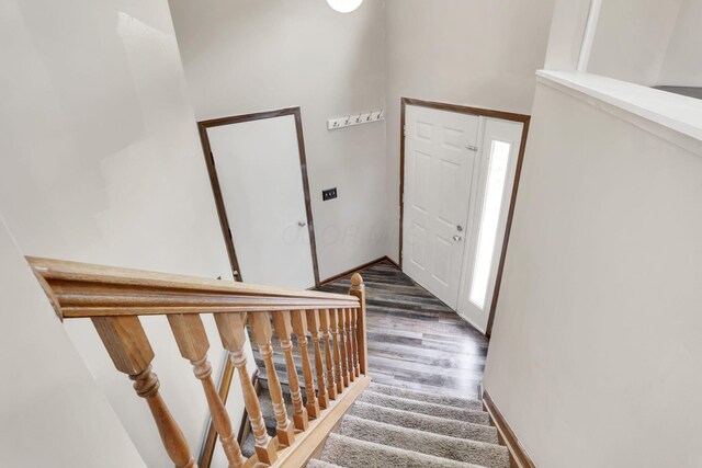 7170 Daugherty Dr, Reynoldsburg, OH 43068 - entryway featuring stairs, wood finished floors, and baseboards