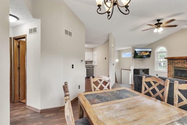 7170 Daugherty Dr, Reynoldsburg, OH 43068 - dining room featuring wood finished floors, a brick fireplace, baseboards, ceiling fan, and a chandelier