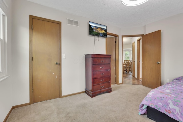 7170 Daugherty Dr, Reynoldsburg, OH 43068 - bedroom featuring light carpet, baseboards, and a textured ceiling