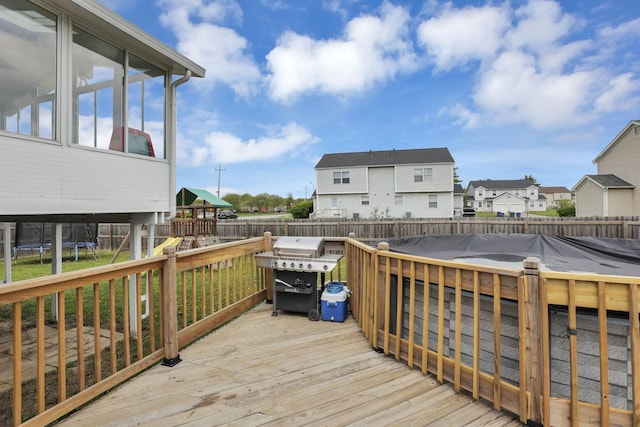 7170 Daugherty Dr, Reynoldsburg, OH 43068 - deck featuring a trampoline, a playground, a residential view, and grilling area