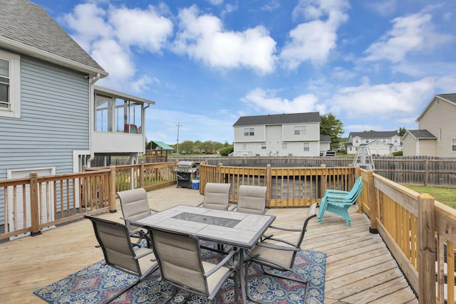 7170 Daugherty Dr, Reynoldsburg, OH 43068 - wooden terrace with outdoor dining area, a fenced backyard, and a residential view