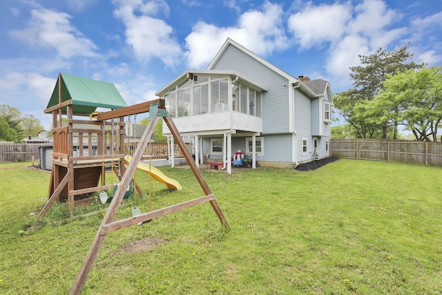7170 Daugherty Dr, Reynoldsburg, OH 43068 - rear view of property with a playground and a sunroom