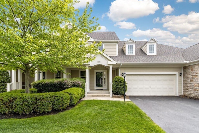 6575 Wensley Ct, Westerville, OH 43082 - view of front of property featuring asphalt driveway, a garage, a front lawn, and a shingled roof