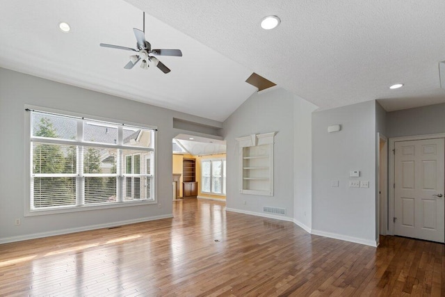 6575 Wensley Ct, Westerville, OH 43082 - unfurnished living room featuring lofted ceiling, a ceiling fan, wood finished floors, baseboards, and recessed lighting