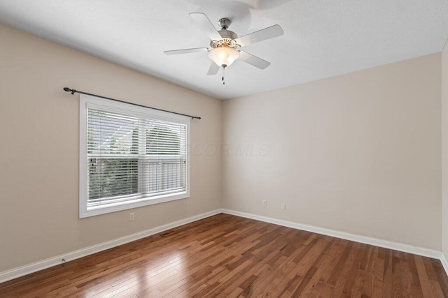 6575 Wensley Ct, Westerville, OH 43082 - empty room with wood finished floors, baseboards, and ceiling fan