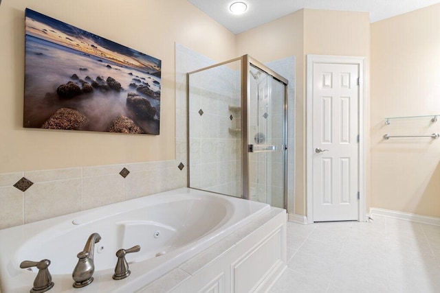 6575 Wensley Ct, Westerville, OH 43082 - bathroom with a shower stall, a tub with jets, baseboards, and tile patterned floors