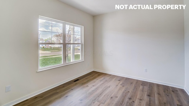 1773 Jacko Ln, Circleville, OH 43113 - unfurnished room with healthy amount of natural light, wood finished floors, and baseboards
