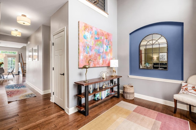 sitting room with wood finished floors and baseboards