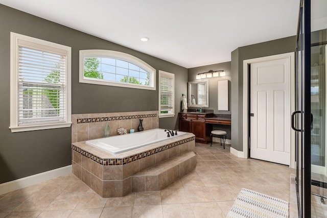 full bathroom featuring a bath, vanity, baseboards, recessed lighting, and tile patterned flooring