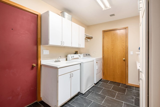 laundry area featuring cabinet space and independent washer and dryer