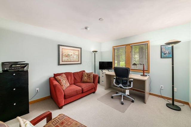 home office featuring baseboards and carpet