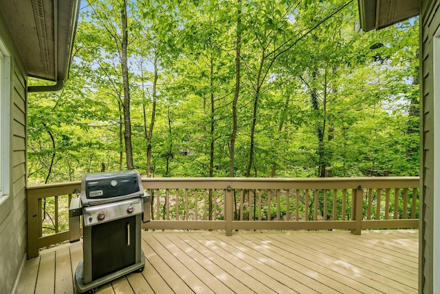 wooden deck featuring area for grilling