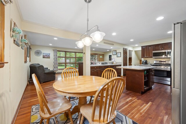 dining room featuring dark wood-type flooring and recessed lighting