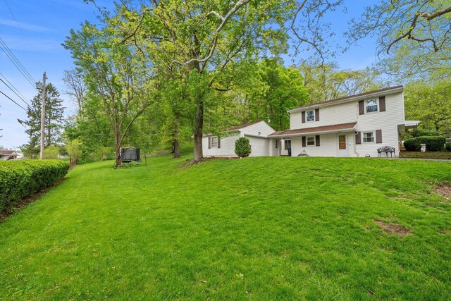 back of house with a yard