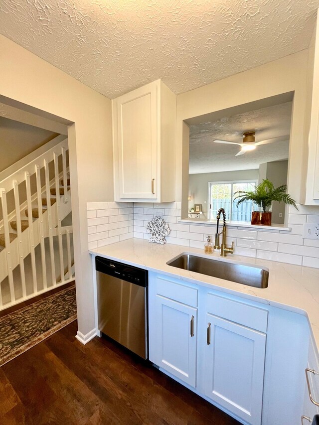 755 Parkbluff Way, Lewis Center, OH 43035 - kitchen featuring dishwasher, dark wood-type flooring, a sink, tasteful backsplash, and a textured ceiling