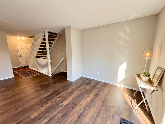 755 Parkbluff Way, Lewis Center, OH 43035 - unfurnished living room featuring wood finished floors, baseboards, and stairs