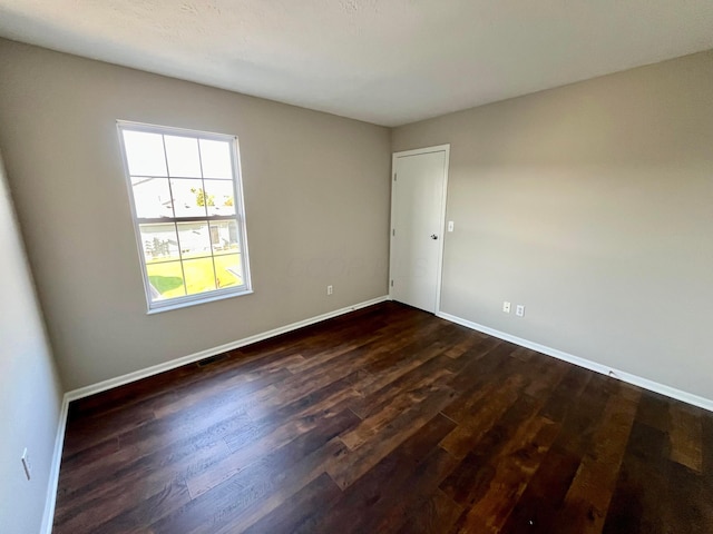 755 Parkbluff Way, Lewis Center, OH 43035 - unfurnished room with dark wood-style floors and baseboards