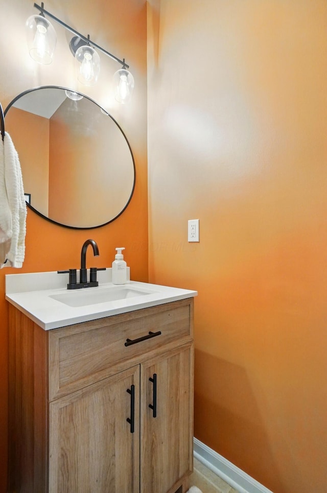 bathroom featuring vanity and baseboards