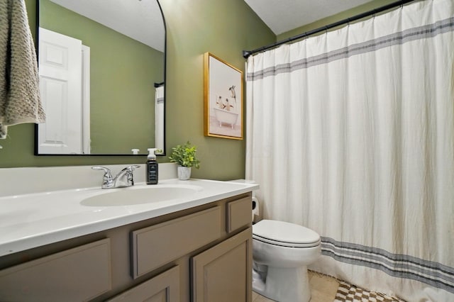 bathroom featuring toilet, vanity, and tile patterned floors