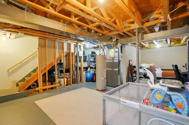 unfinished basement featuring gas water heater, stairs, and heating unit
