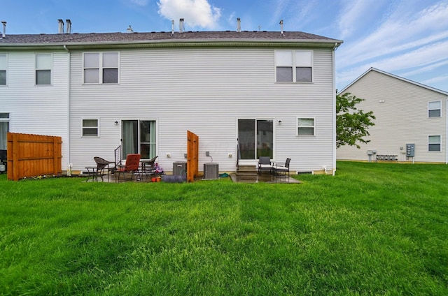 rear view of house featuring a patio and cooling unit