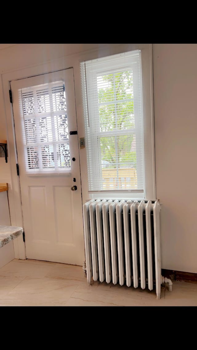 1065 Sunbury Rd, Columbus, OH 43219 - entryway featuring radiator heating unit