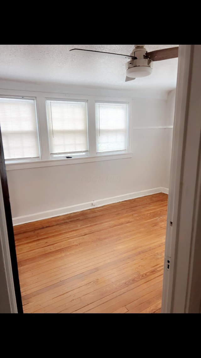 1065 Sunbury Rd, Columbus, OH 43219 - empty room featuring light wood-style floors and baseboards