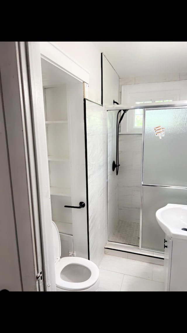 1065 Sunbury Rd, Columbus, OH 43219 - full bathroom with a shower stall, vanity, and tile patterned floors
