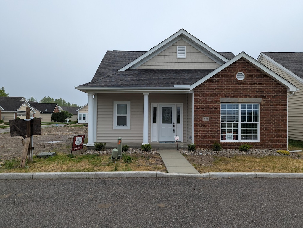 421 Republic Way, Marion, OH 43302 - view of front of house with roof with shingles and brick siding