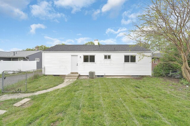 rear view of house featuring central AC unit and entry steps