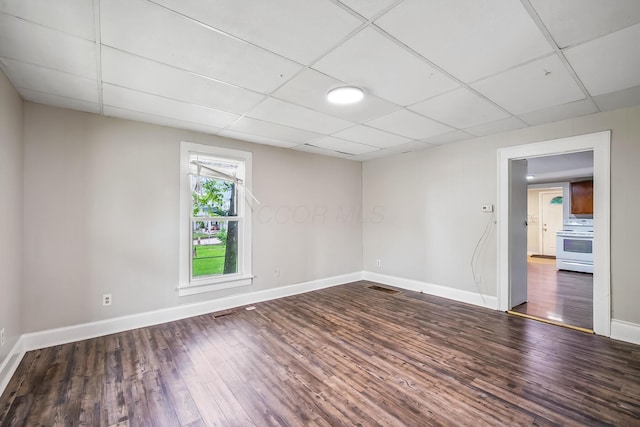 349 E Central Ave, Delaware, OH 43015 - unfurnished room with baseboards, wood finished floors, and a drop ceiling