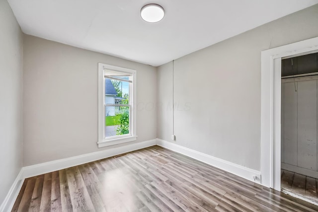 349 E Central Ave, Delaware, OH 43015 - unfurnished bedroom featuring wood finished floors and baseboards