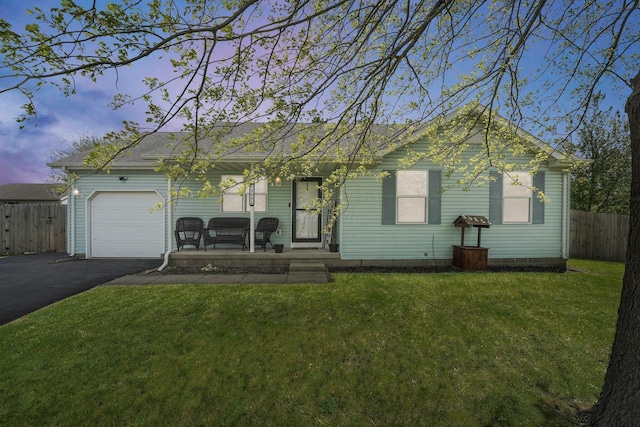 509 Section Line Dr, South Charleston, OH 45368 - ranch-style house with asphalt driveway, a garage, covered porch, and roof with shingles