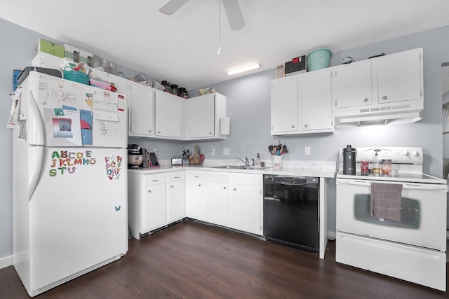 509 Section Line Dr, South Charleston, OH 45368 - kitchen with white appliances, a sink, light countertops, under cabinet range hood, and dark wood finished floors