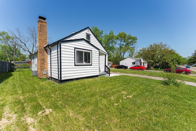 view of property exterior featuring a chimney