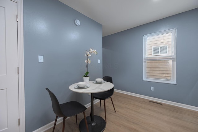 1828 Ferris Rd, Columbus, OH 43224 - dining room with light wood-type flooring and baseboards