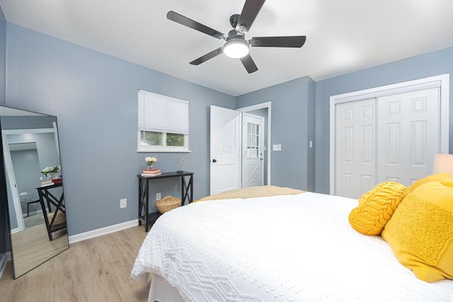 1828 Ferris Rd, Columbus, OH 43224 - bedroom with light wood-style flooring, a closet, and a ceiling fan