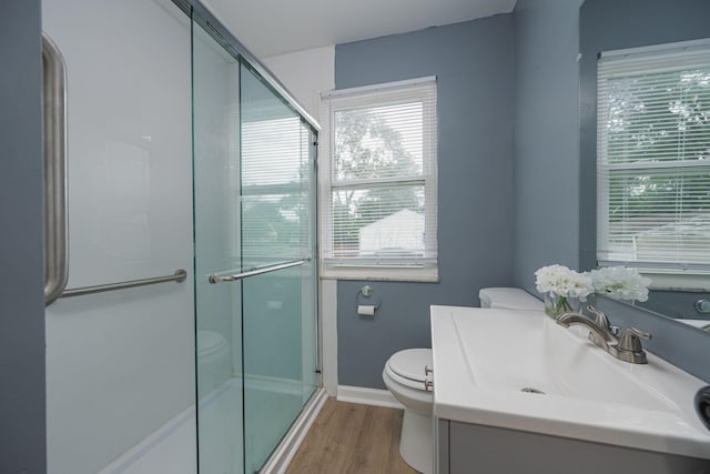 1828 Ferris Rd, Columbus, OH 43224 - full bath with a stall shower, wood finished floors, and vanity