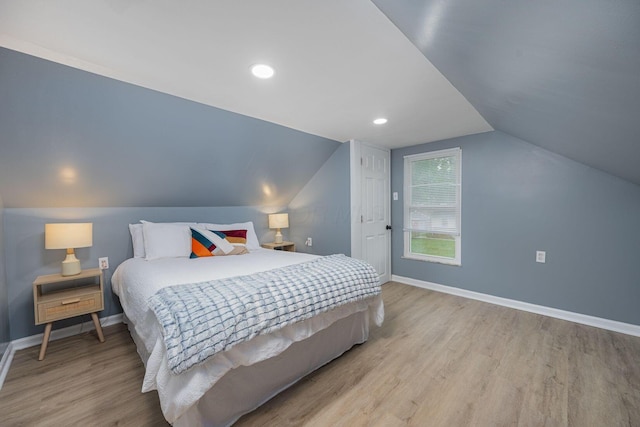1828 Ferris Rd, Columbus, OH 43224 - bedroom featuring wood finished floors and lofted ceiling