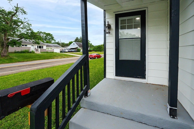 1828 Ferris Rd, Columbus, OH 43224 - property entrance featuring a porch and a lawn