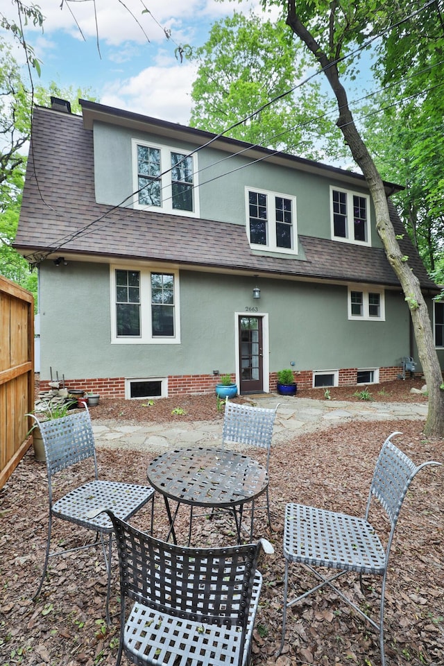 2663 Glen Echo Dr, Columbus, OH 43202 - rear view of property with stucco siding, a patio, and roof with shingles