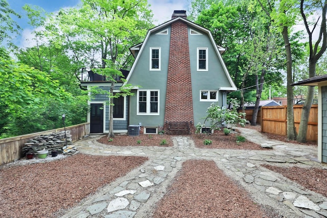 2663 Glen Echo Dr, Columbus, OH 43202 - rear view of property with fence, a chimney, central air condition unit, and a gambrel roof
