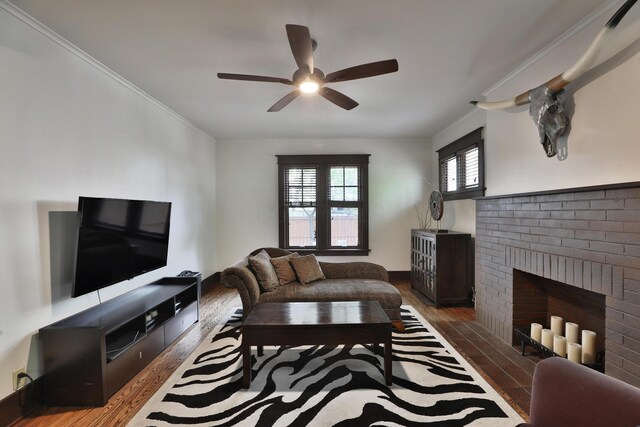 2663 Glen Echo Dr, Columbus, OH 43202 - living room with a ceiling fan, wood finished floors, a brick fireplace, crown molding, and baseboards