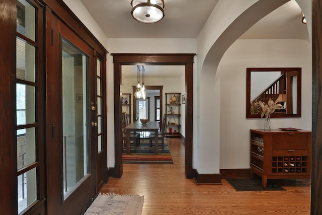 2663 Glen Echo Dr, Columbus, OH 43202 - hallway with arched walkways, wood finished floors, and baseboards